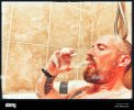 man-drinking-a-pint-of-water-while-immersed-in-a-very-hot-bath-S1GY4K.jpg